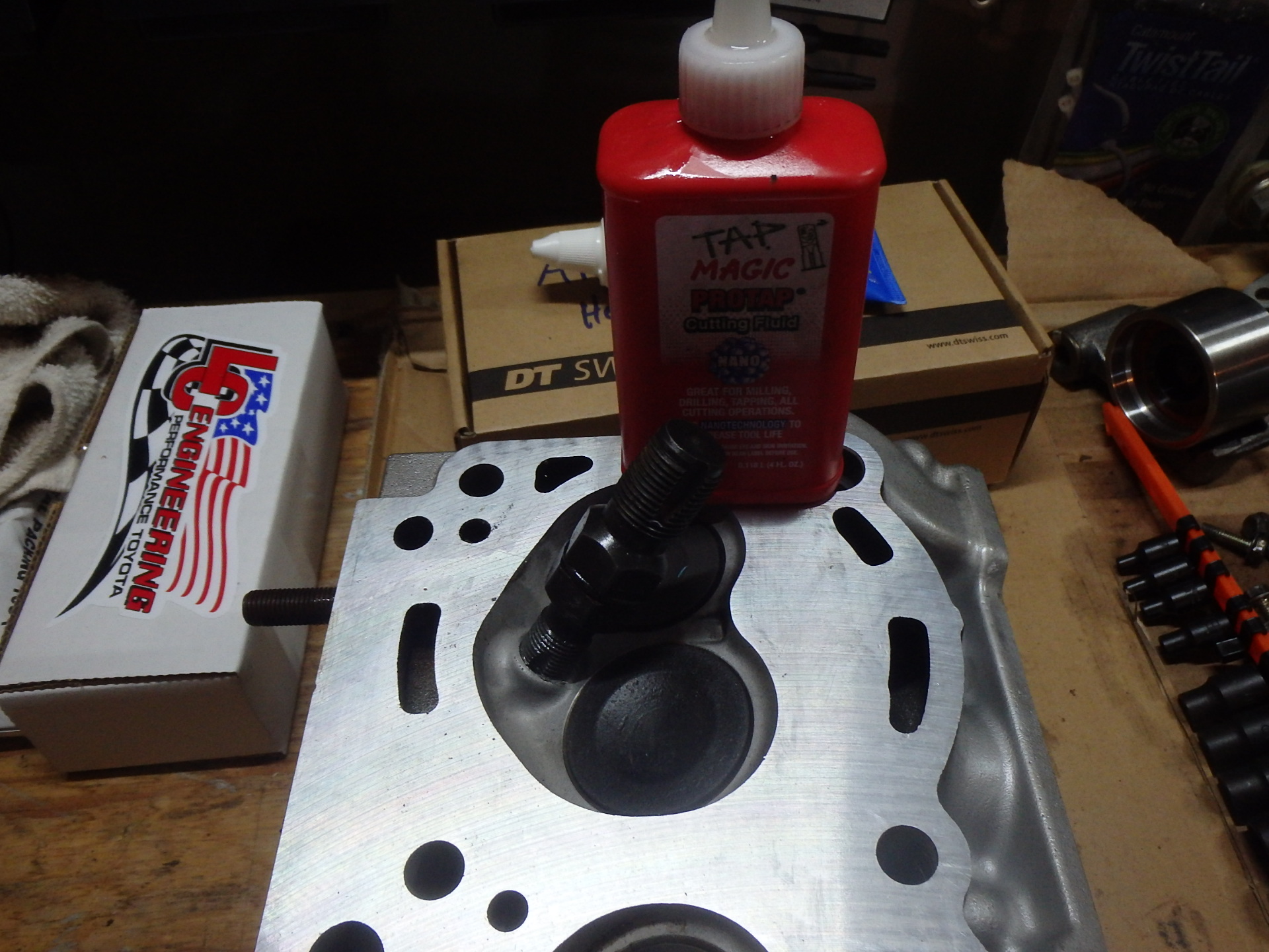 Tapping spark plug holes